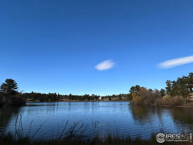 a backyard of a house with barbeque oven