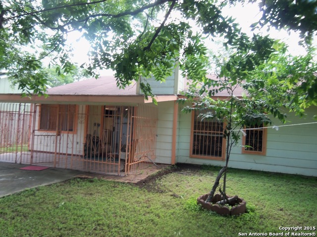 5878 Cliff Path San Antonio, TX 78250 - Photo 2 of 12 a backyard of a house with lots of plants and tree