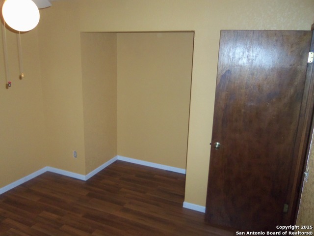 5878 Cliff Path San Antonio, TX 78250 - Photo 8 of 12 a view of empty room with wooden floor