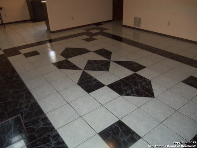 5878 Cliff Path San Antonio, TX 78250 - Photo 9 of 12 a black and white checkered floor