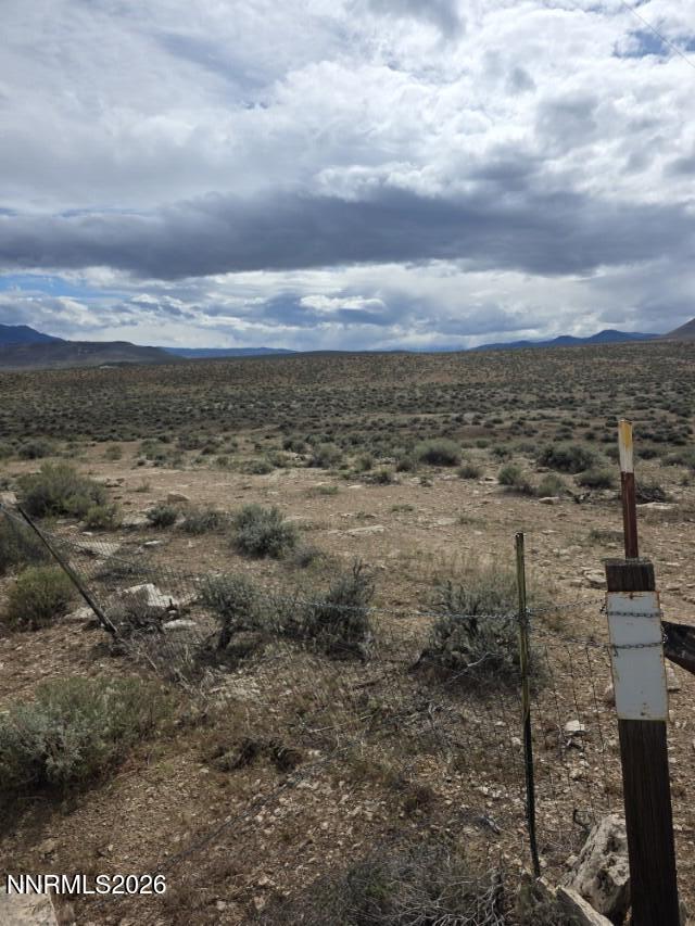 0 Shawnee Road, Unit 21 Stagecoach, NV 89429 - Photo 27 of 34 a view of a dry yard with wooden fence