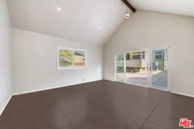 a view of a backyard with large trees