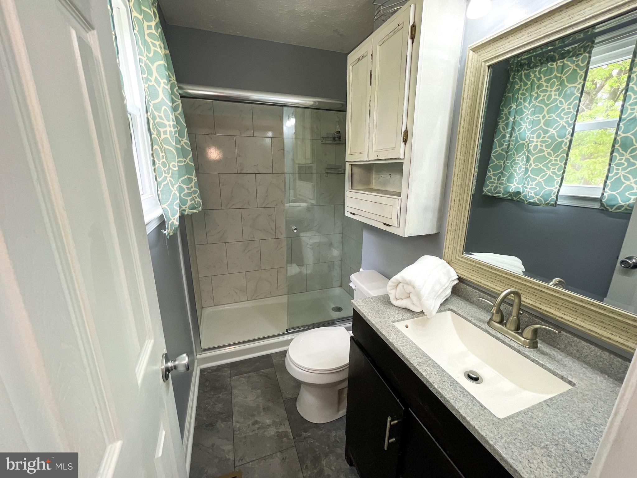 7607 WB&A Road Severn, MD 21144 - Photo 22 of 40 Updated primary bathroom with custom glass doors!