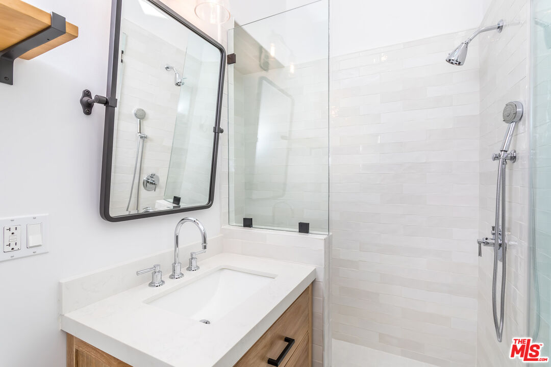 336 Rennie Avenue, Unit C Venice, CA 90291 - Photo 20 of 23 a bathroom with a sink vanity tub and shower