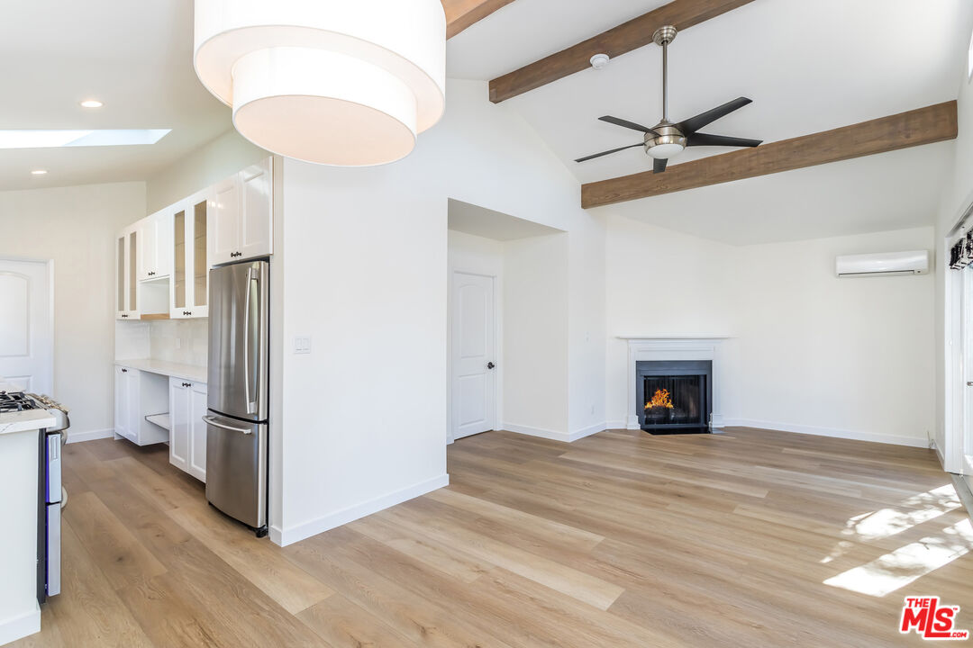 336 Rennie Avenue, Unit C Venice, CA 90291 - Photo 6 of 23 a view of a kitchen with a fridge and wooden floor