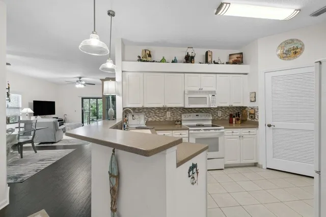 a kitchen with a sink cabinets and window
