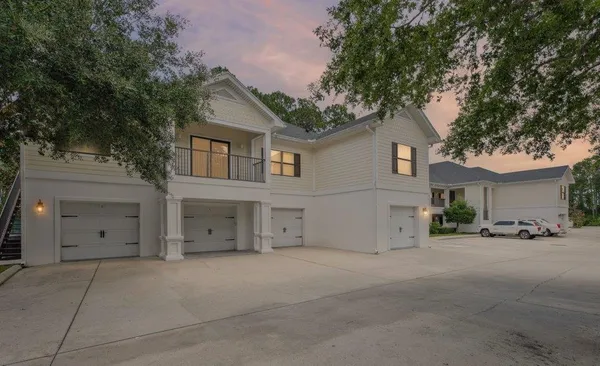 front view of a house with a tree