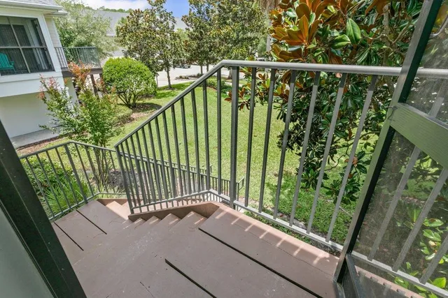 a view of a balcony with wooden floor