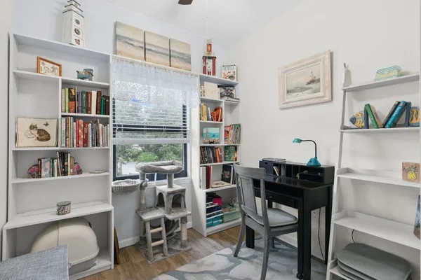 a room with furniture cabinets and a window