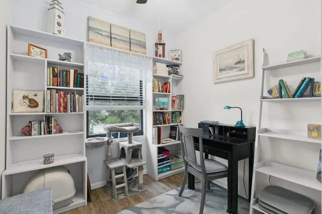a room with furniture cabinets and a window