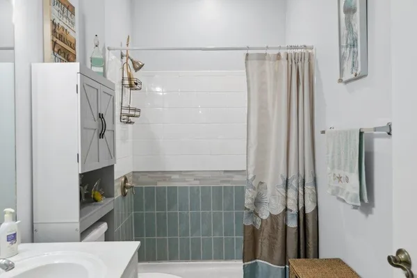 a bathroom with a shower and a toilet
