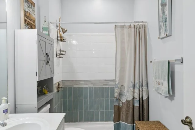 a bathroom with a shower and a toilet