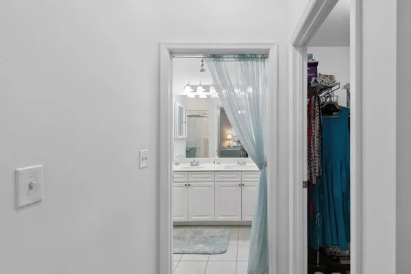 a view of a bathroom with a sink and mirror