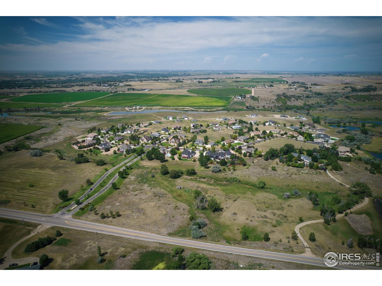 19 Lakeview Circle Fort Morgan, CO 80701 - Photo 10 of 11 a view of a yard with an outdoor space
