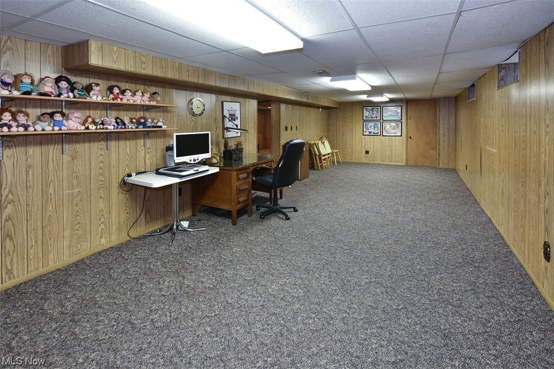 4026 Stonehaven Road Cleveland, OH 44121 - Photo 25 of 30 Carpeted office featuring wooden walls and a drop ceiling