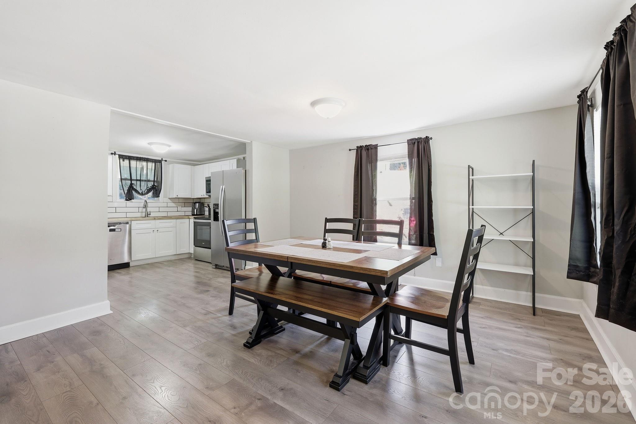 197 Mulberry Street Clyde, NC 28721 - Photo 6 of 31 a view of a dining room with furniture and window