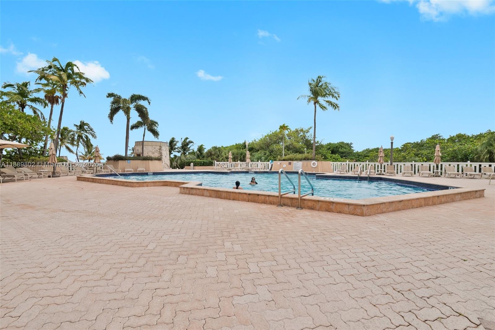 1121 Crandon Boulevard, Unit D304 Key Biscayne, FL 33149 - Photo 20 of 42 a view of a swimming pool and an outdoor space