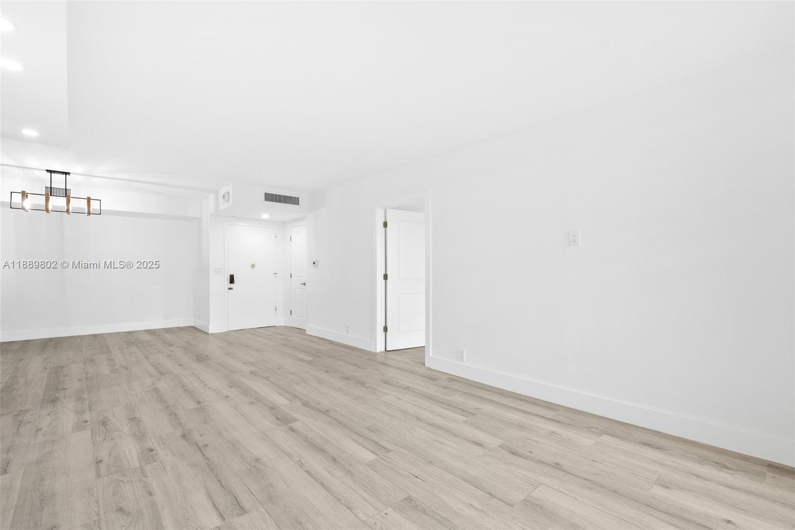 1121 Crandon Boulevard, Unit D304 Key Biscayne, FL 33149 - Photo 33 of 42 a view of empty room with wooden floor