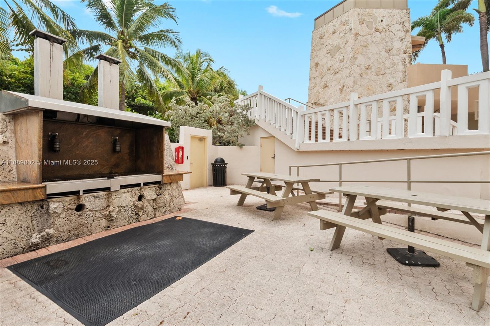 1121 Crandon Boulevard, Unit D304 Key Biscayne, FL 33149 - Photo 40 of 42 a living room with furniture and a flat screen tv