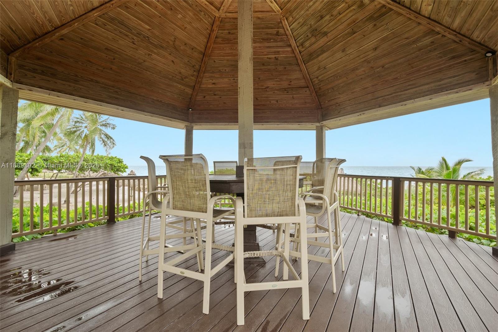 1121 Crandon Boulevard, Unit D304 Key Biscayne, FL 33149 - Photo 41 of 42 a view of a chairs and table in the balcony