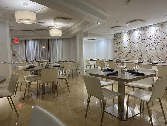 1121 Crandon Boulevard, Unit D304 Key Biscayne, FL 33149 - Photo 42 of 42 a view of a dining room with furniture and wooden floor