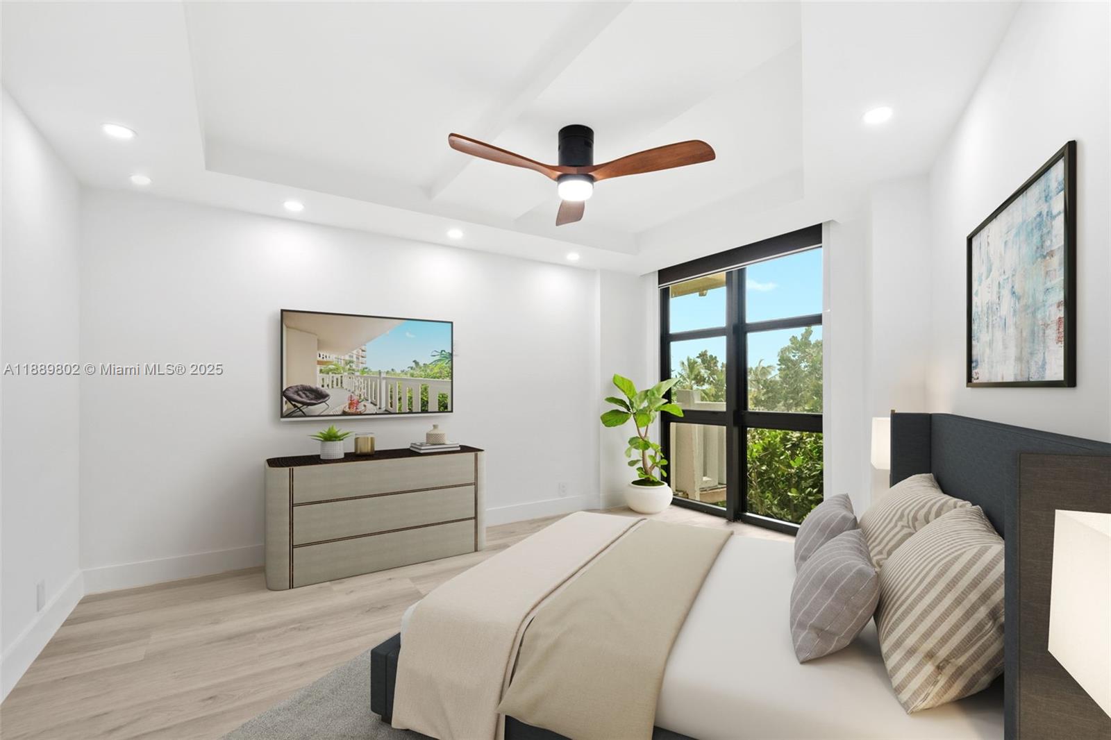 1121 Crandon Boulevard, Unit D304 Key Biscayne, FL 33149 - Photo 7 of 42 a bedroom with a bed painting on wall and a large window