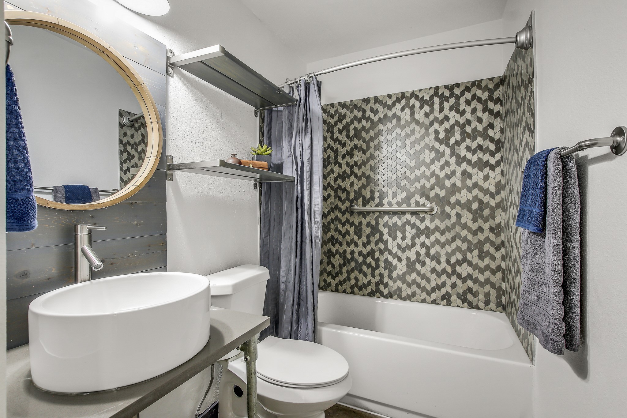 2124 Burton Drive, Unit 164 Austin, TX 78741 - Photo 15 of 37 a white toilet sitting next to a bathroom sink and shower