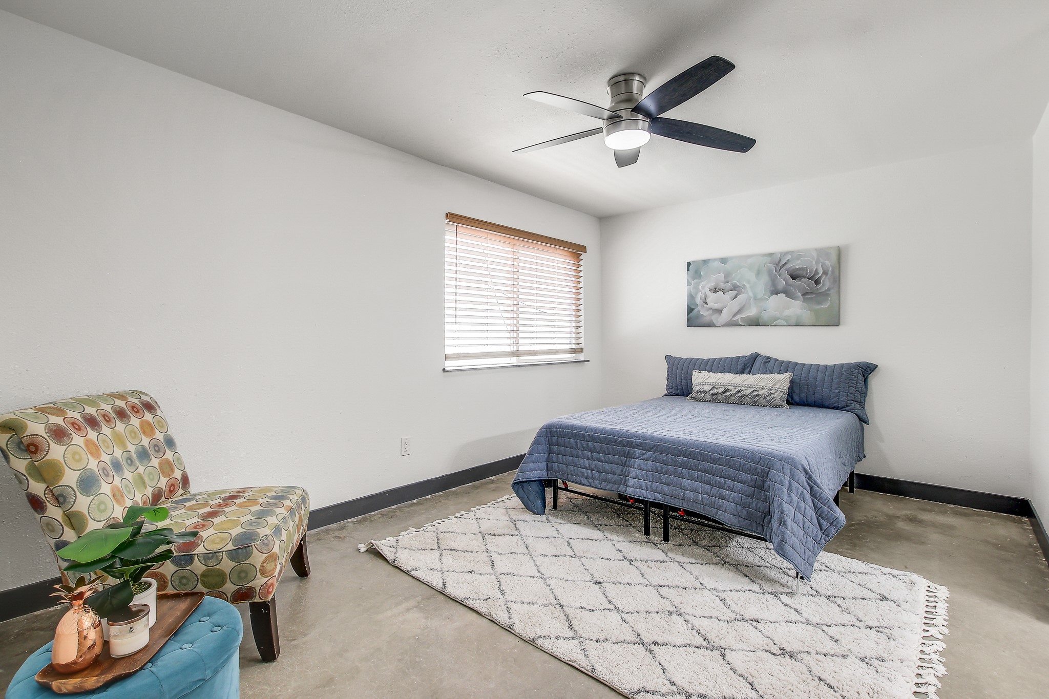 2124 Burton Drive, Unit 164 Austin, TX 78741 - Photo 16 of 37 a bedroom with furniture and a window