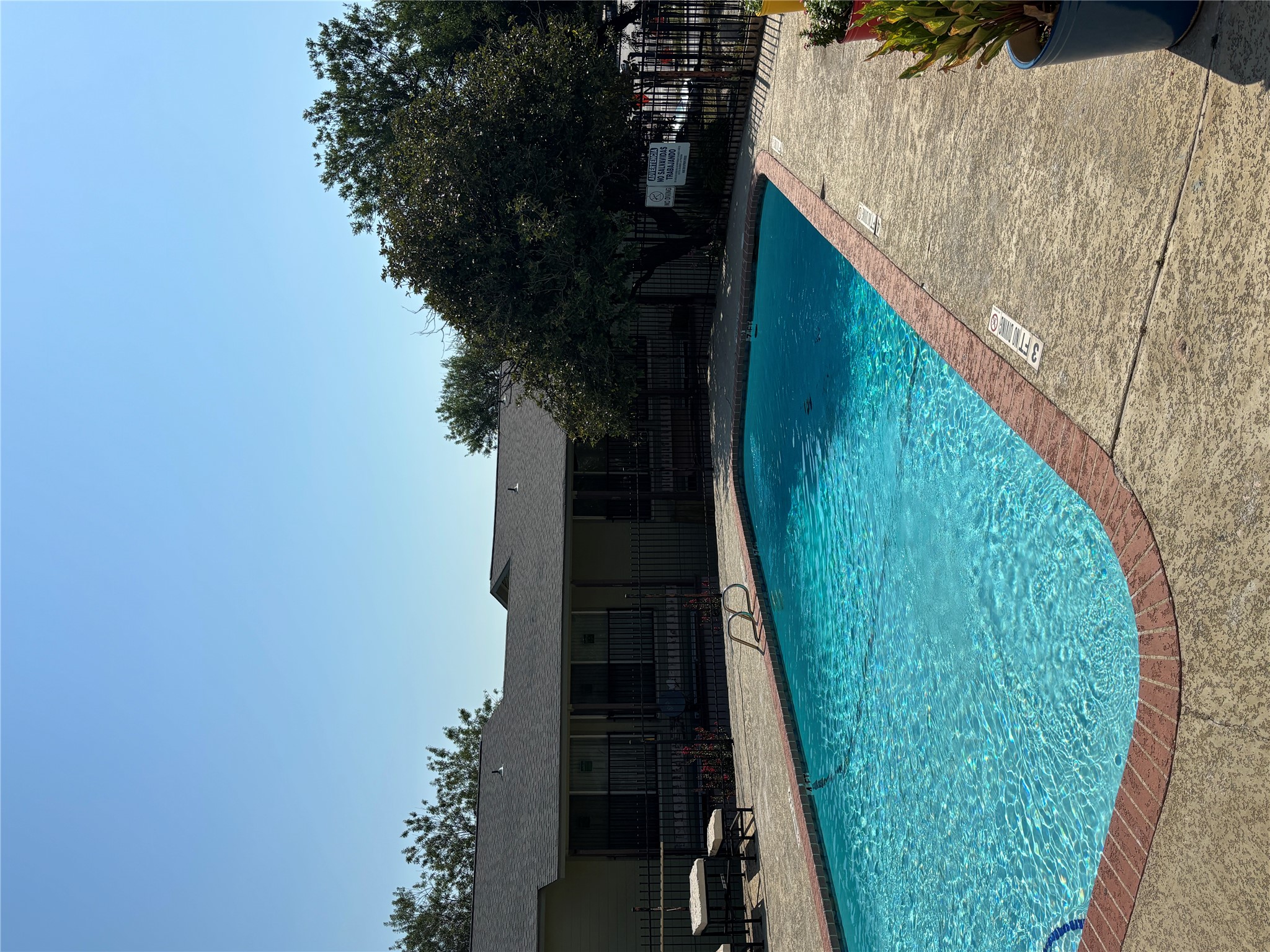 2124 Burton Drive, Unit 164 Austin, TX 78741 - Photo 24 of 37 a view of a backyard with a garden