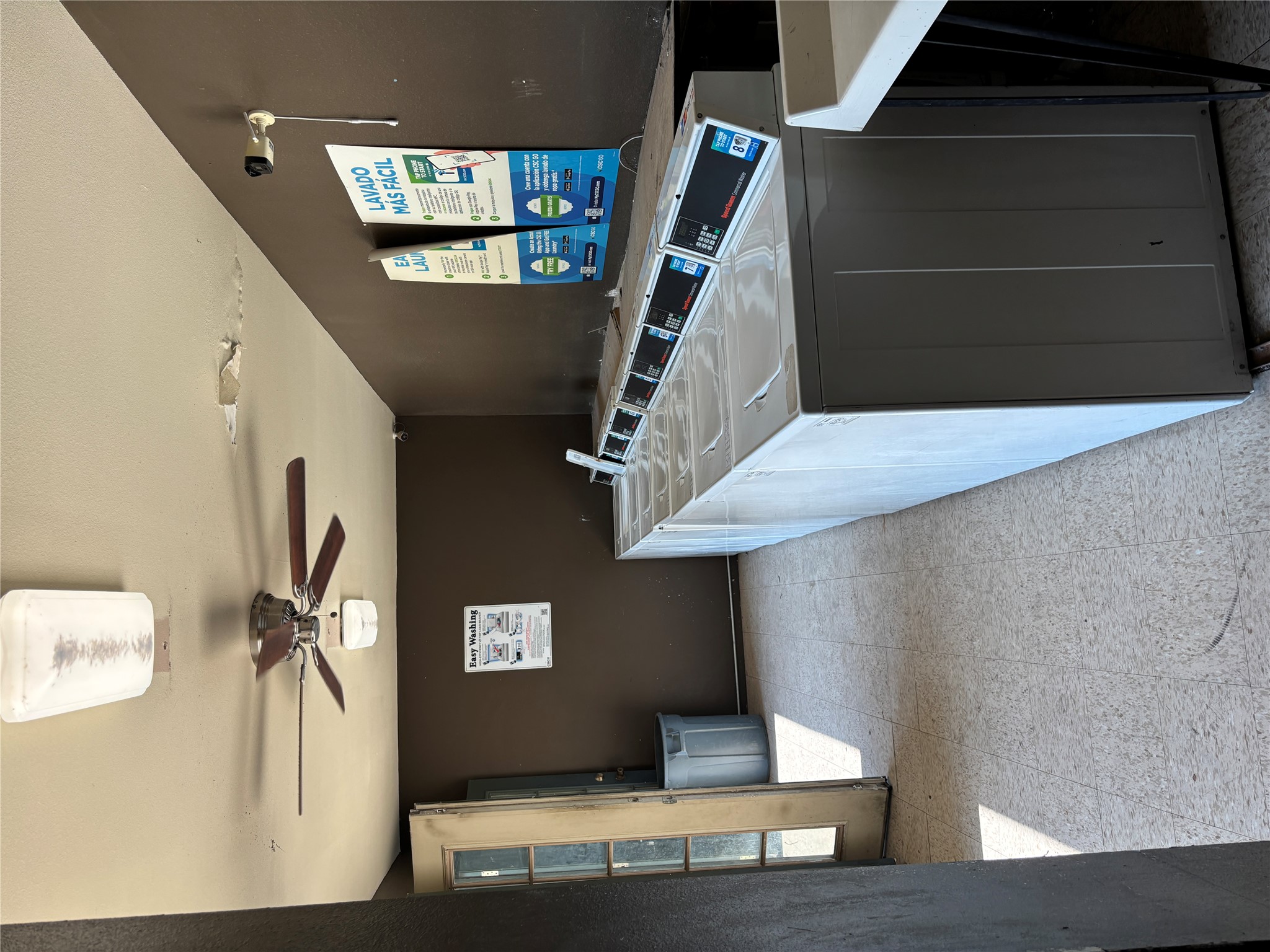 2124 Burton Drive, Unit 164 Austin, TX 78741 - Photo 30 of 37 a kitchen with a stove and a hallway