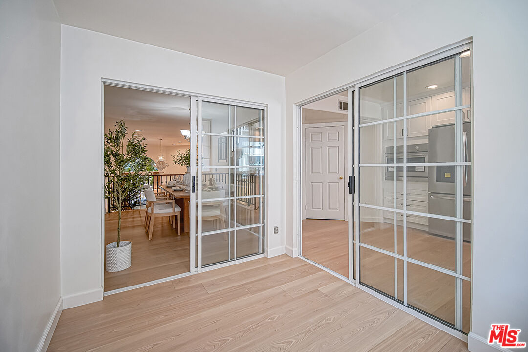 2950 South Bentley Avenue, Unit 3 Los Angeles, CA 90064 - Photo 11 of 32 a room that has a sliding door