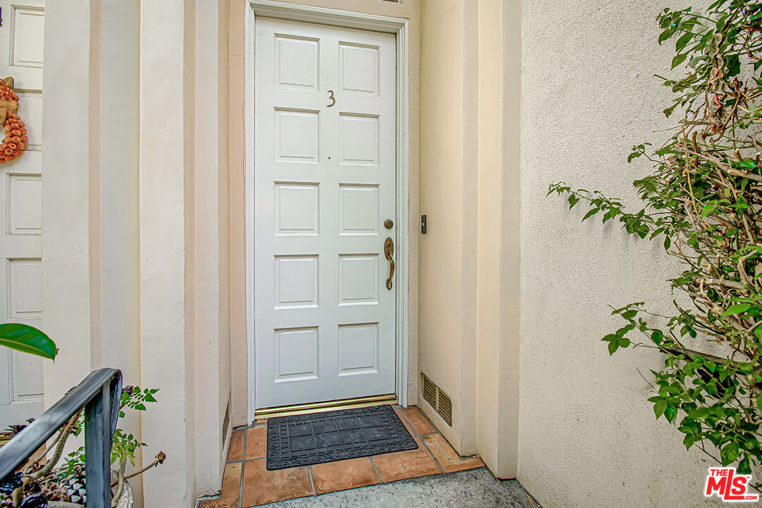 2950 South Bentley Avenue, Unit 3 Los Angeles, CA 90064 - Photo 32 of 32 an entryway with wooden floor and a plant