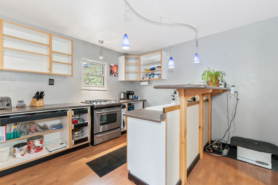 250 South Spruce Street Hayden, CO 81639 - Photo 14 of 46 a view of a kitchen with fridge and wooden floor