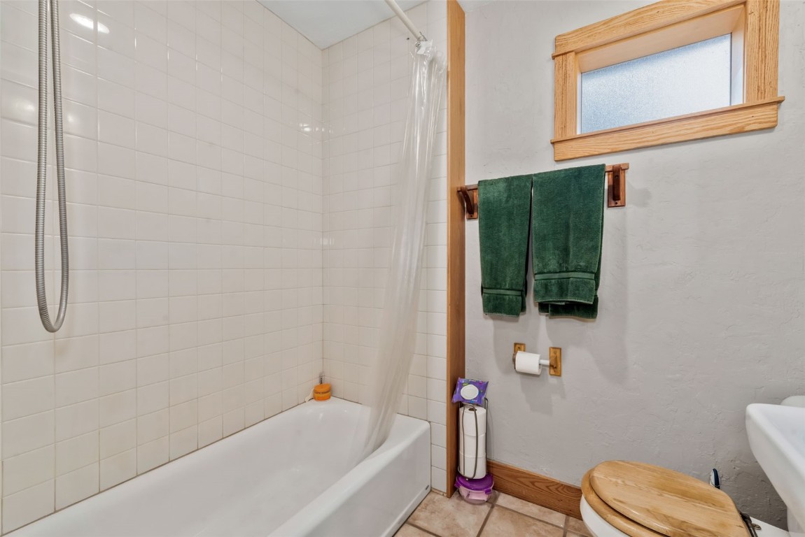 250 South Spruce Street Hayden, CO 81639 - Photo 22 of 46 a bathroom with a toilet sink and mirror