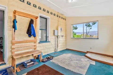 a view of an entryway with wooden floor