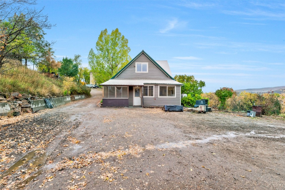 250 South Spruce Street Hayden, CO 81639 - Photo 5 of 46 a front view of a house with a yard and garage