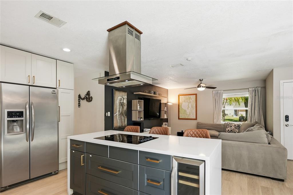 4606 Buckeye Road Tampa, FL 33624 - Photo 13 of 39 a kitchen with stainless steel appliances granite countertop a sink a stove and a refrigerator