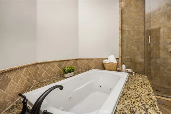 a bathroom with a bathtub and shower