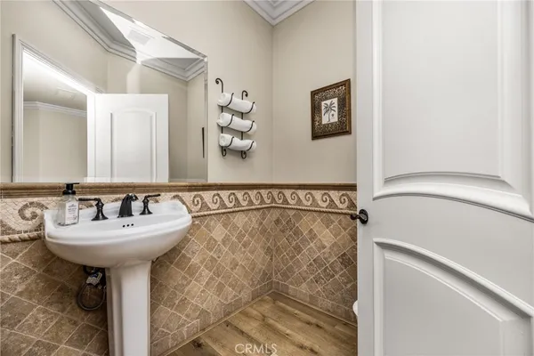 a bathroom with a sink mirror and toilet