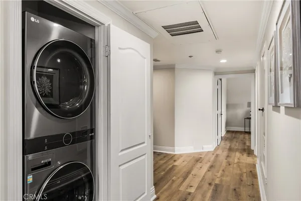 a view of a hallway with washer and dryer