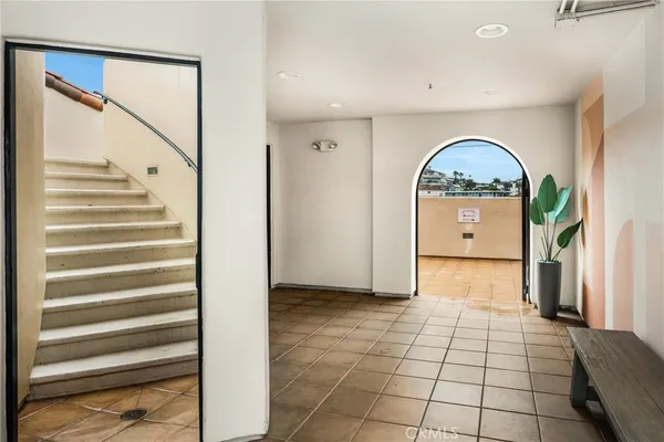 a view of a livingroom with wooden floor and entryway