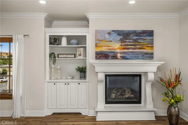 a view of fireplace with wooden floor