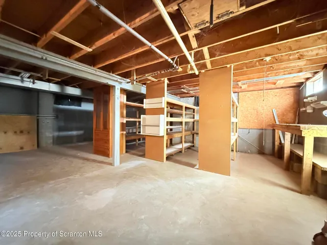a view of an empty room with a utility room