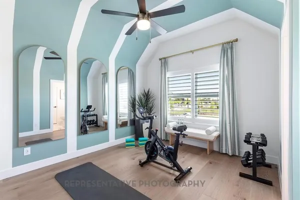 a living room with furniture a window and a chandelier