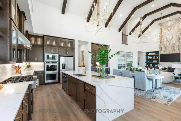 a large white kitchen with lots of counter top space