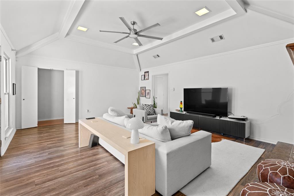 3506 Ruidoso Drive Arlington, TX 76017 - Photo 6 of 37 Spacious living area featuring wood-finish flooring, a tray ceiling with recessed lighting, and a modern ceiling fan