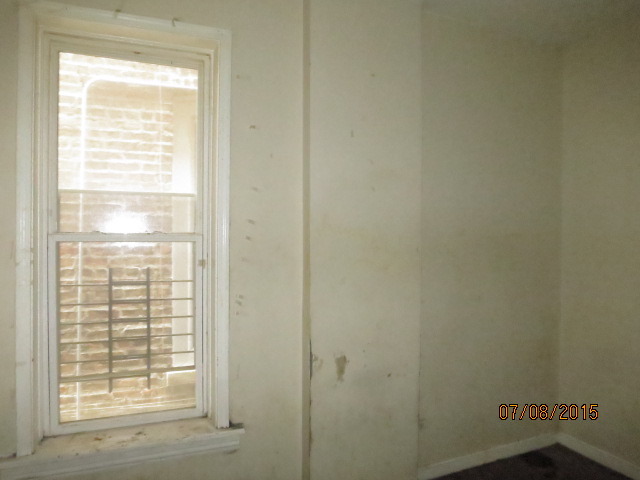 6006 South Carpenter Street Chicago, IL 60621 - Photo 5 of 15 a view of an empty room with a window