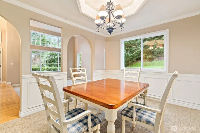 a view of a dining room with furniture window and outside view