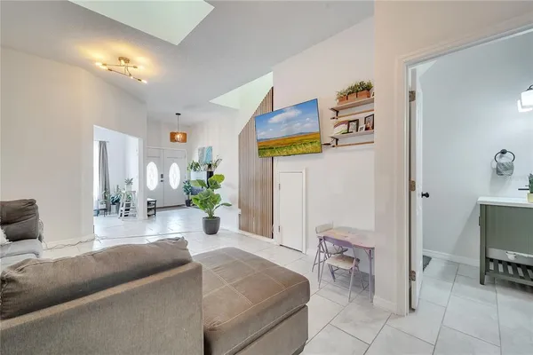 a kitchen with refrigerator and cabinets
