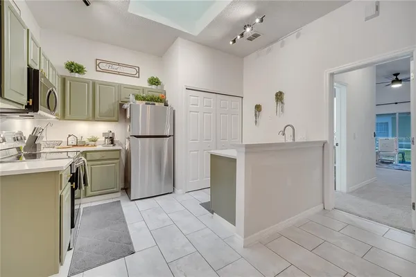 a kitchen with a sink stove and microwave